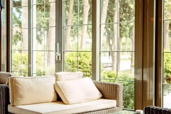 outdoor-sofa-with-beige-cushions-coffee-table-front-restaurant-window_140725-2562